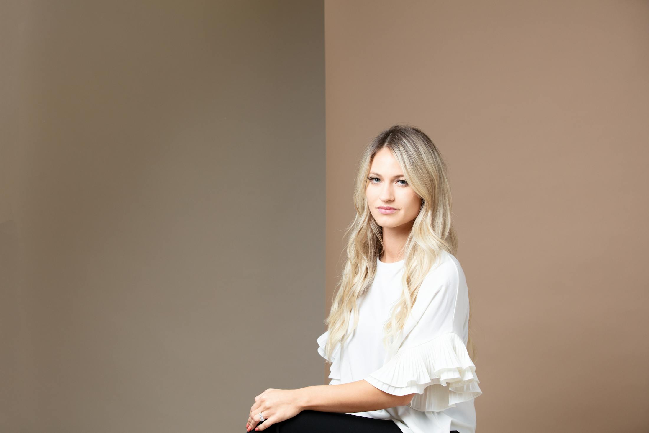 Woman in a white shirt smiling