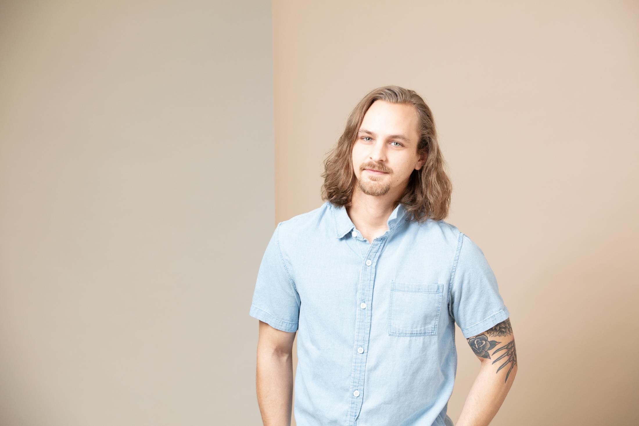 Man in a blue shirt smiling