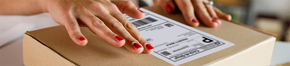 Person preparing to ship packages.